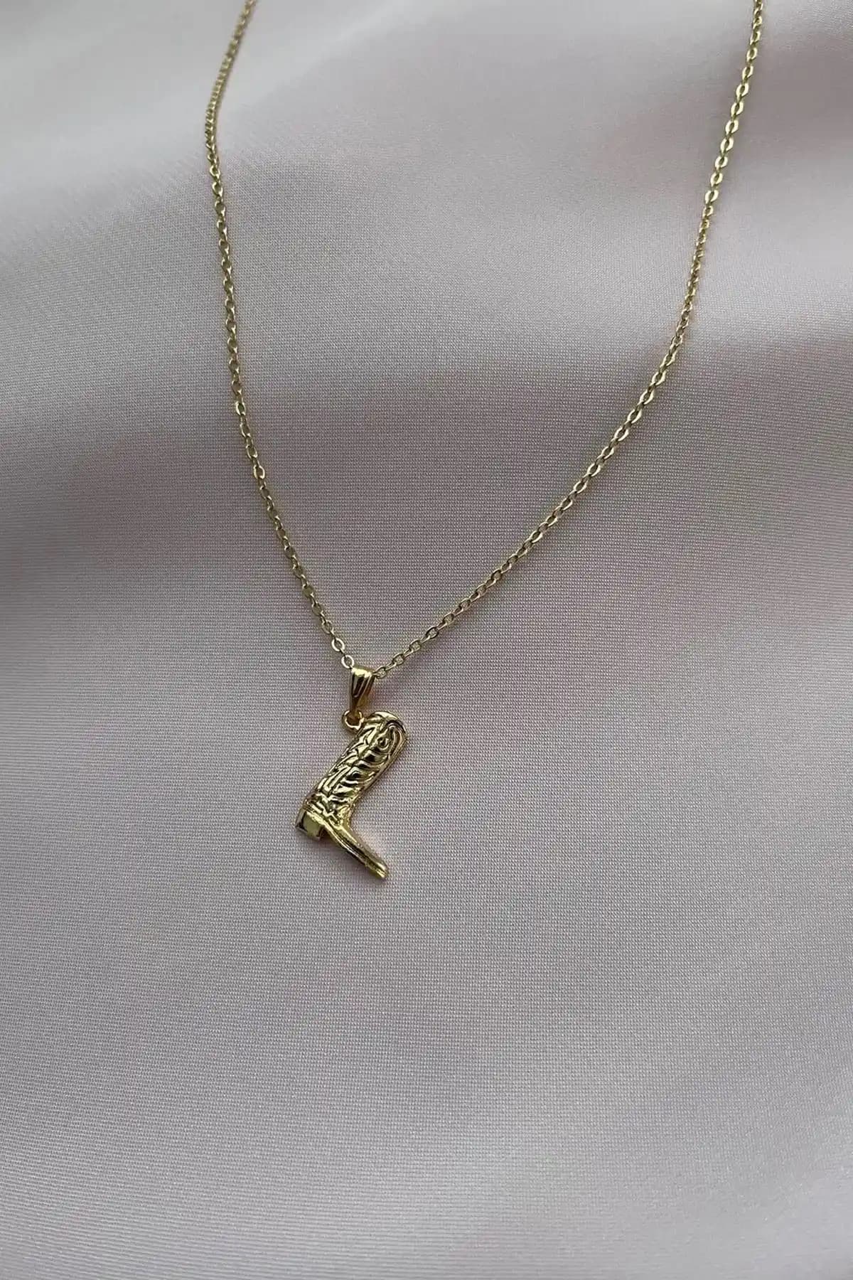 Alexis Carrel Kadın Gold Kovboy Çizme ve Asia Chic Altın Kaplama Göz Kolye Karşılaştırması