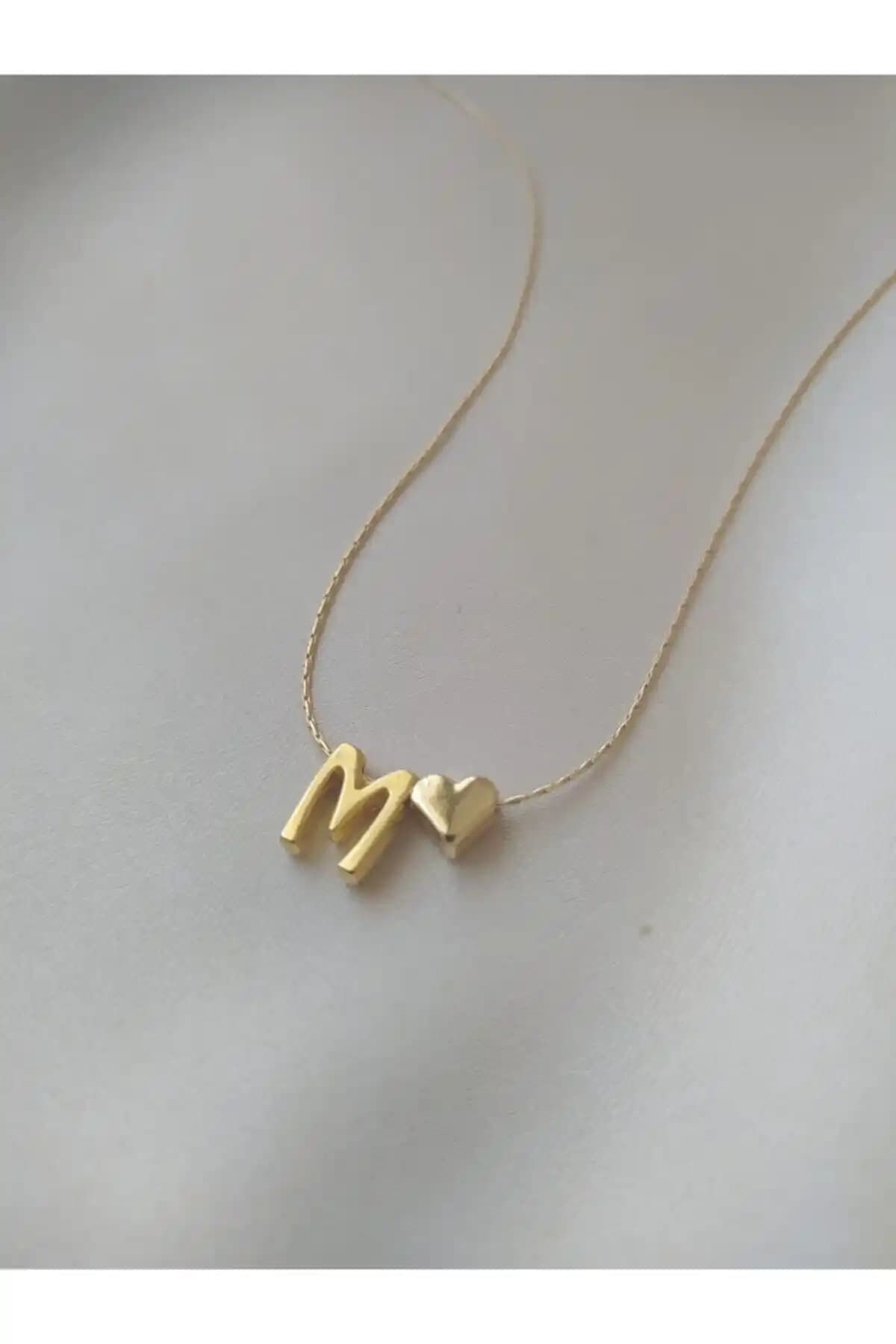 Asia by Leuvoié M Harfli ve Asia Chic Incili Deniz Kabuğu Kolye Karşılaştırması