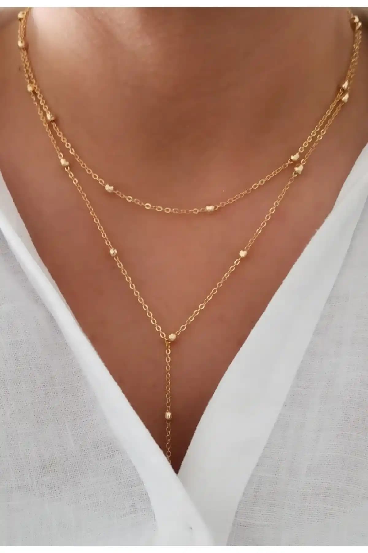 Denizdenal Sarkıntılı Kolye Gold Kaplama: Şıklık ve Dayanıklılığı Bir Arada Sunar