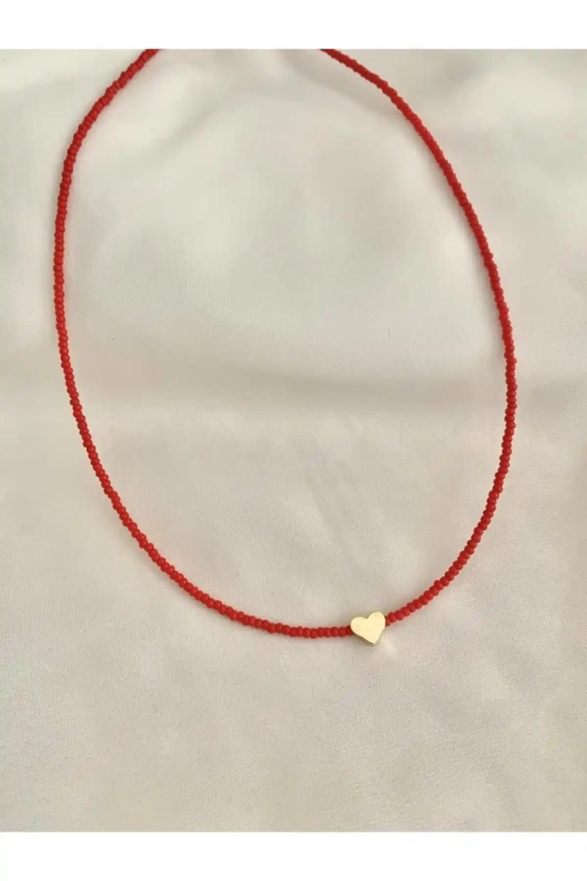 Genel Markalar Kalpli Kırmızı ve monalisatoka Ka<dı>n Gold Kalp Kolye Karşılaştırması