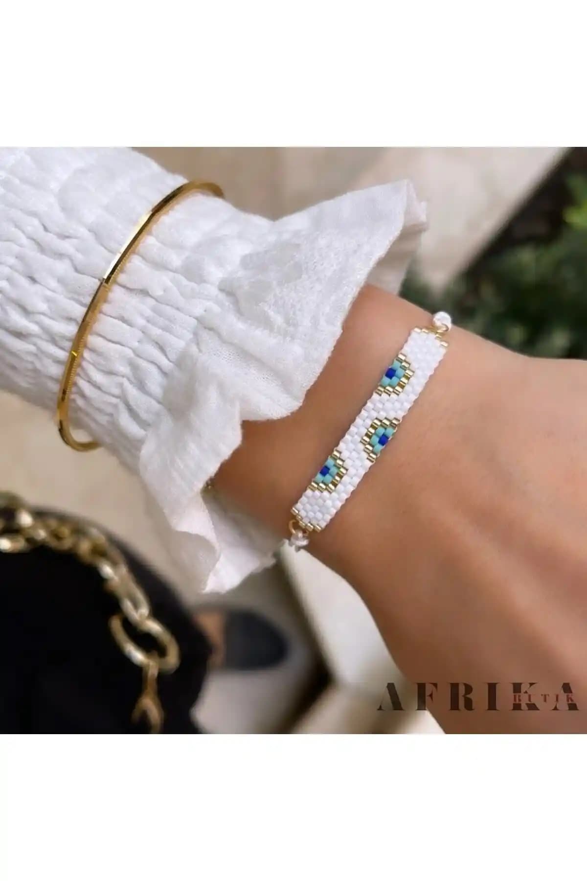 Afrika Butik Beyaz Nazar Miyuki Bileklik: Şıklık ve Dayanıklılığın Modern Buluşması