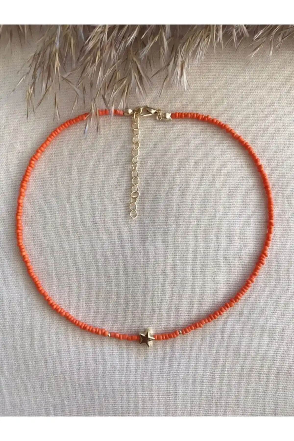 Esen Aksesuar Turuncu Yıldızlı Uçlu Kolye: Şık ve Enerjik Tarzlar İçin Modern Takı