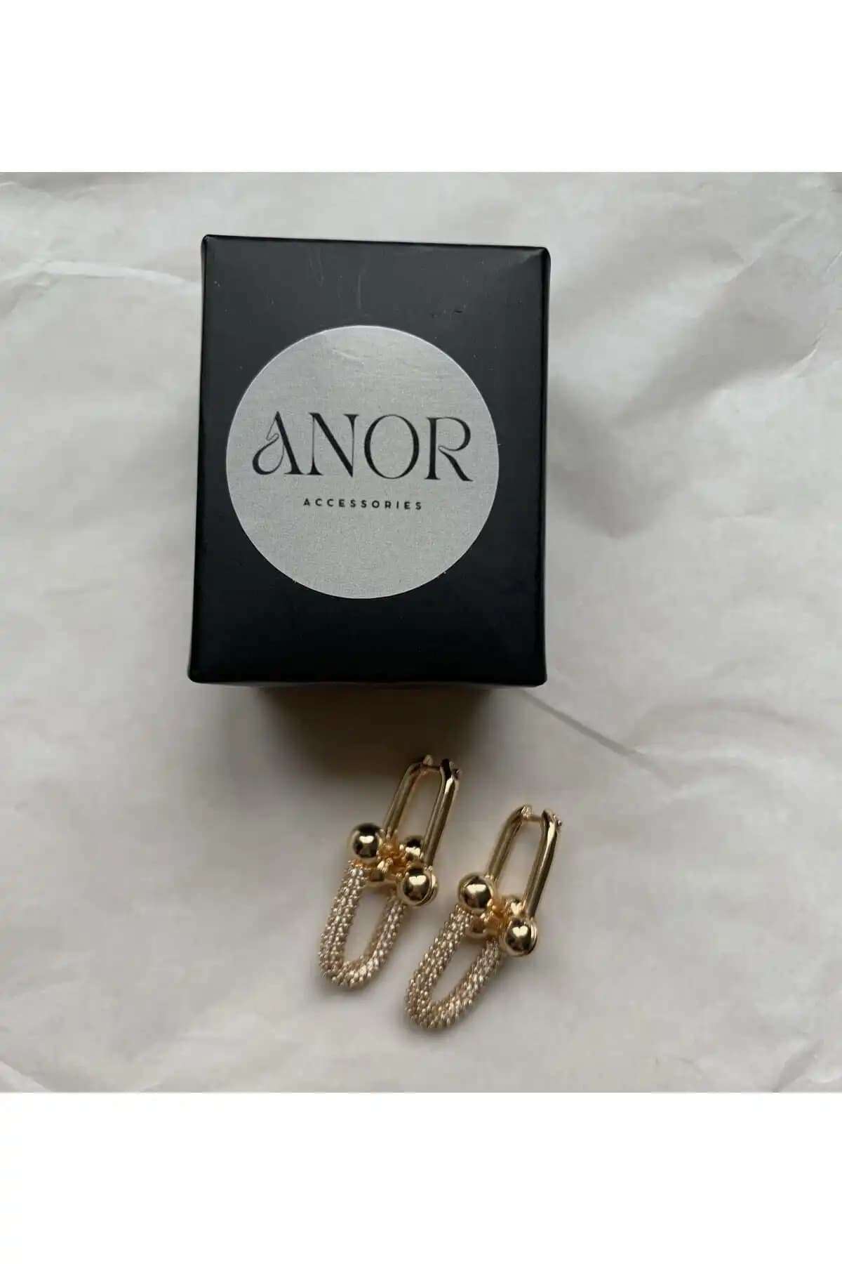 ANOR ACCESSORIES ve Çelik Gizar Aks Zirkon Taşlı Küpe Karşılaştırması 1