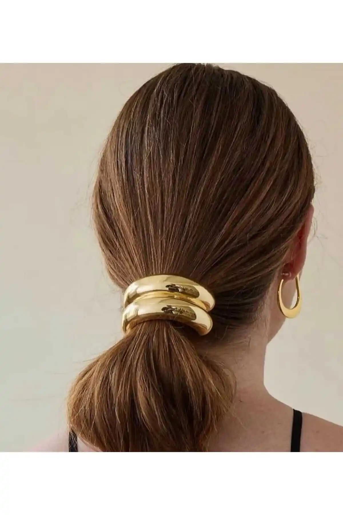 Monalisa Kadın Lastikli Toka Gold: Şıklık ve Fonksiyonellik Sunan Modern Saç Aksesuarı